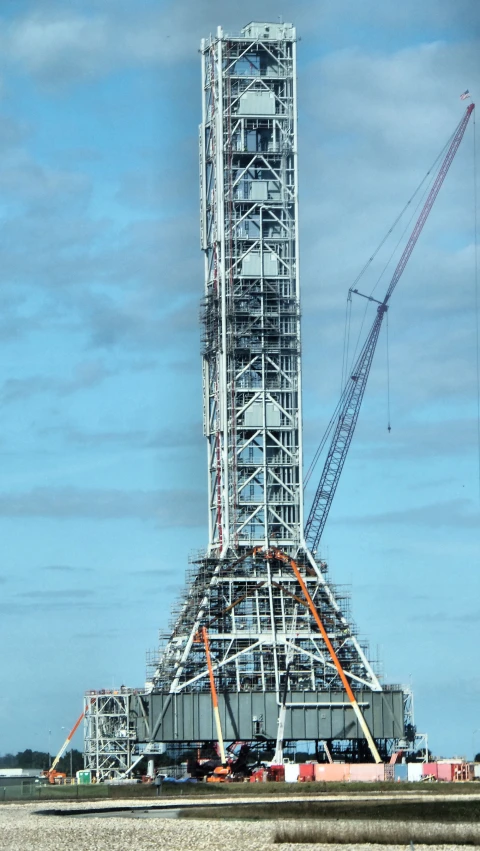 a crane and other construction equipment near the ocean