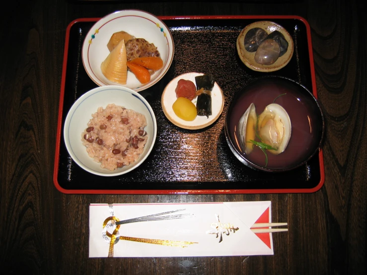 a tray with some plates of food on it