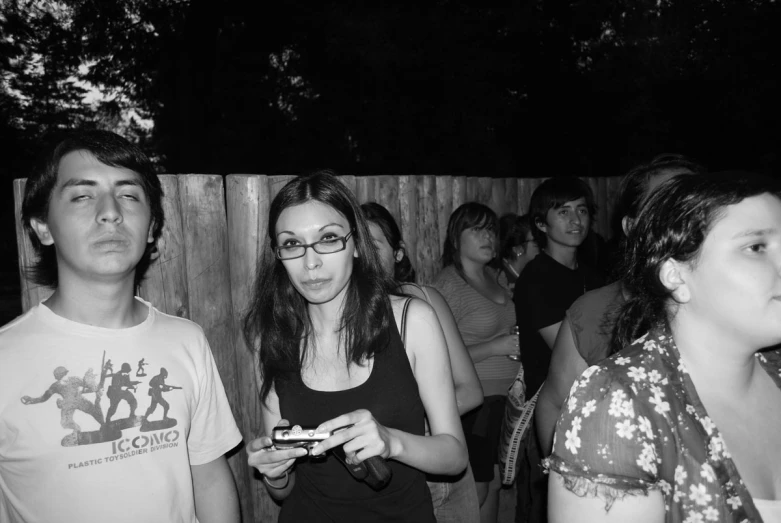 two young people are standing in front of a crowd