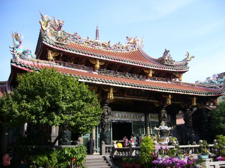 a chinese pavilion is shown in the middle of the day