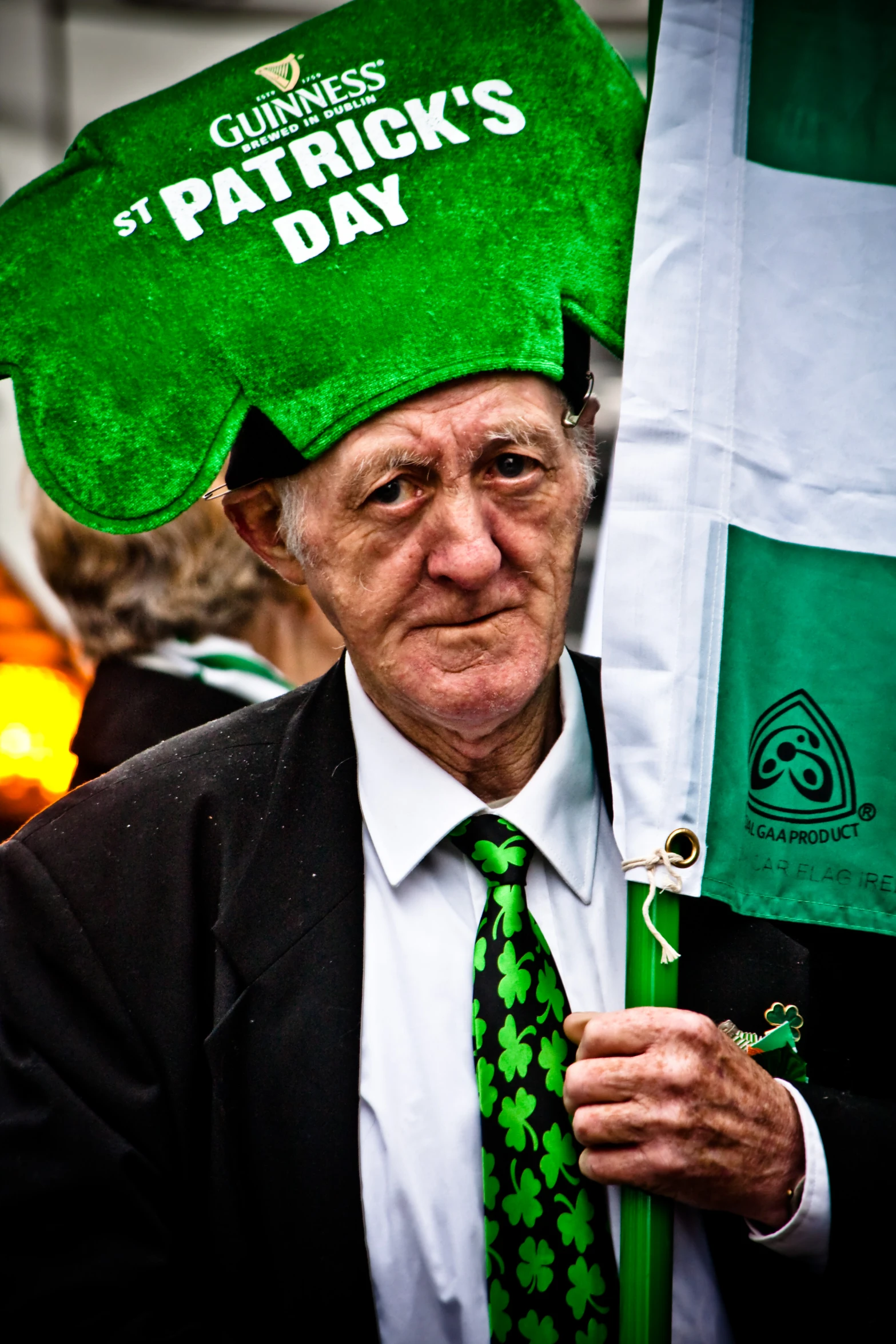 an old man wearing a saint patrick's day hat