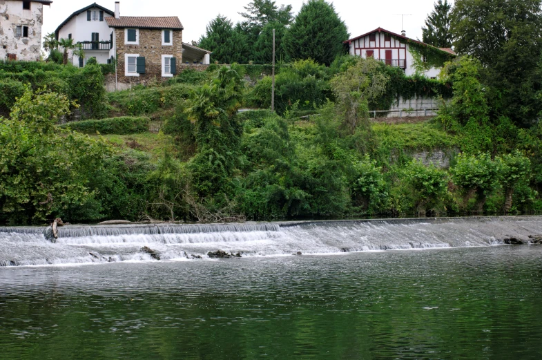 a person is riding a wakeboard on a river