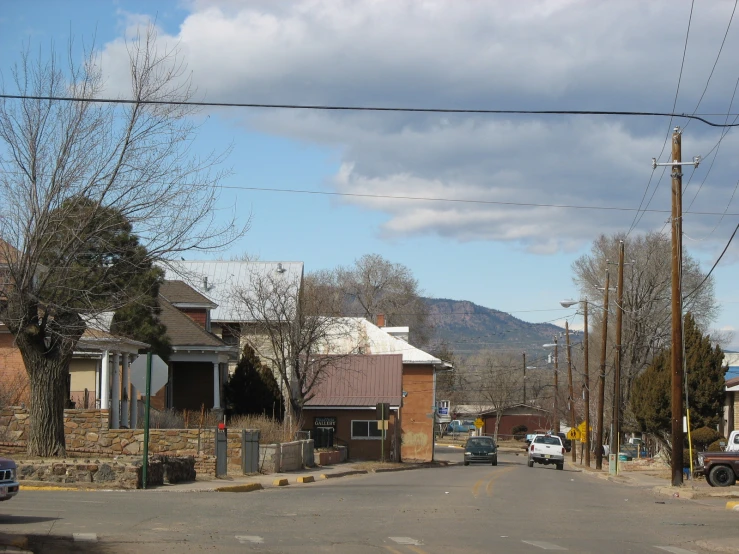 a road is lined with houses in the mountains