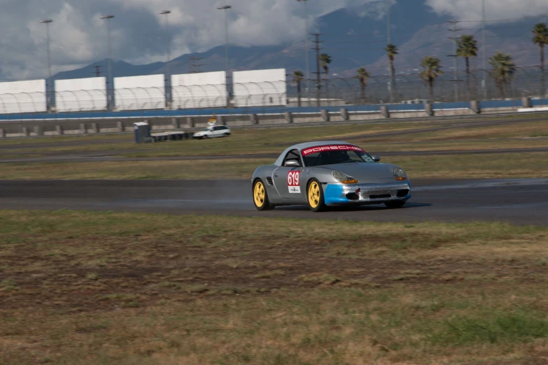 the racing car in front has two tires on it