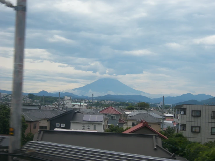 a view from a rooftop looking at a mountain range