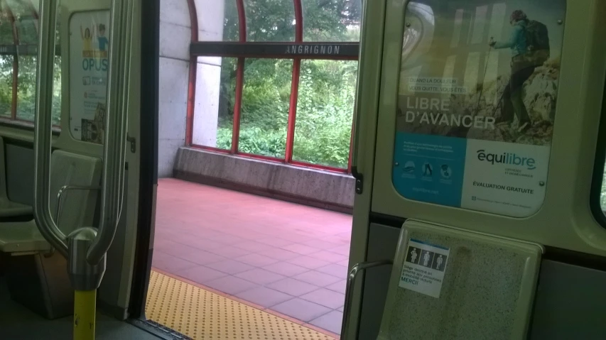 a subway car with open doors at night