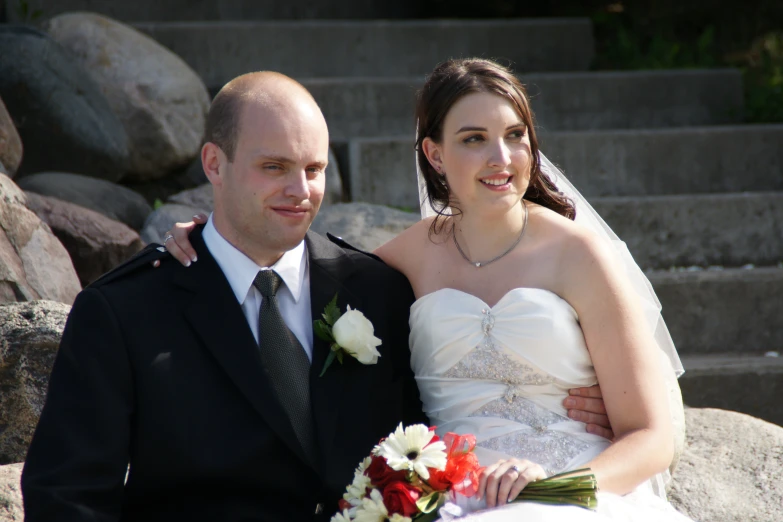 the newly married couple poses for a pograph