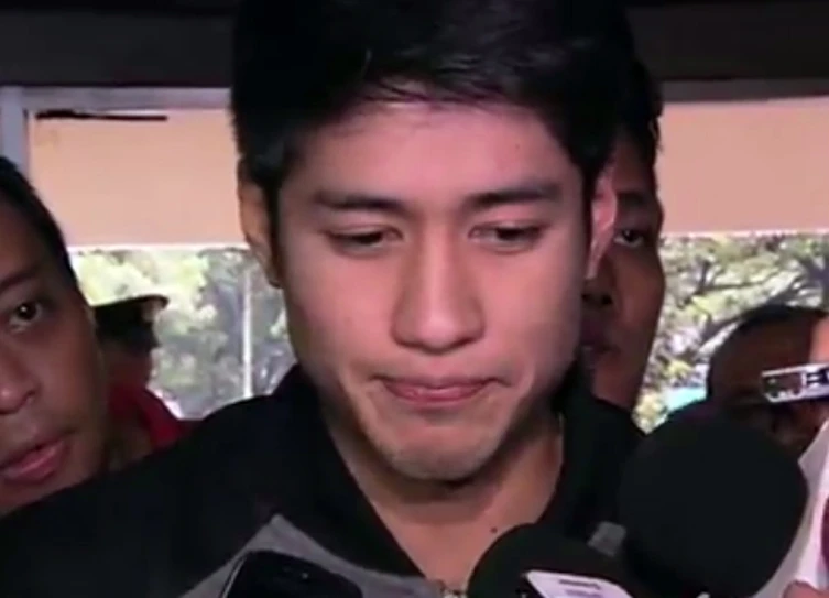 a man standing with a news conference and microphone