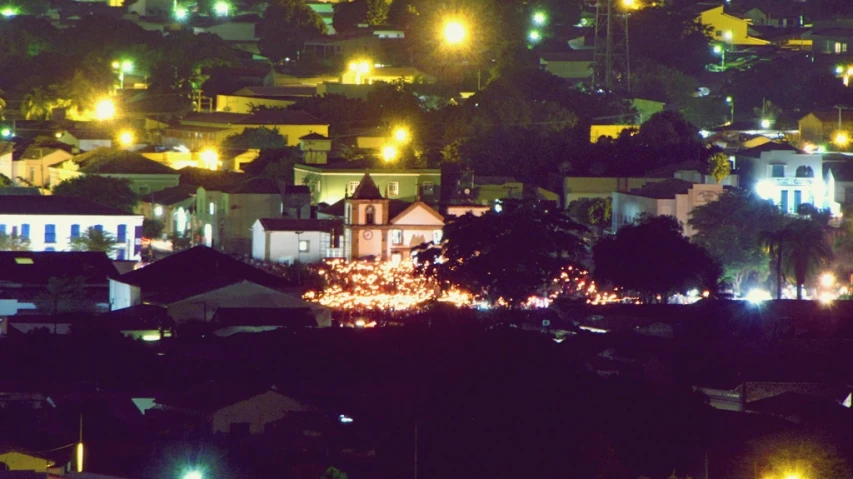 many houses and trees in the night lights