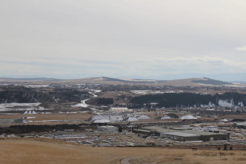 a small town in a big field with snow