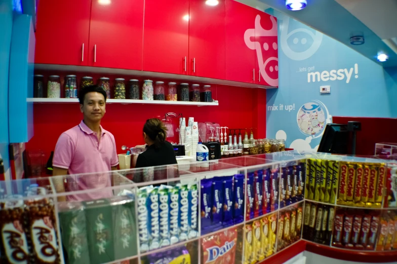 man and woman standing at counter in a store