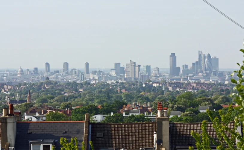 the cityscape is far out to the foreground, with a distant tree line in the foreground