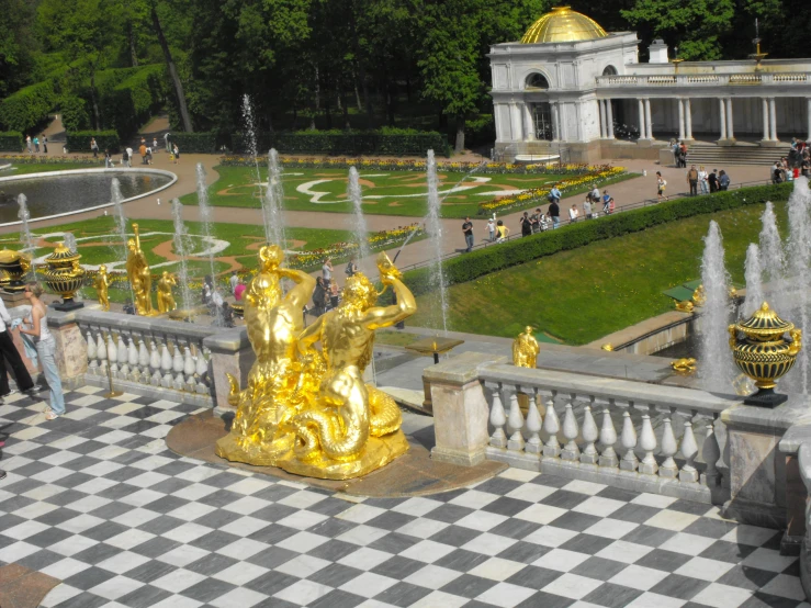 a statue sits in the middle of a checkered floored area