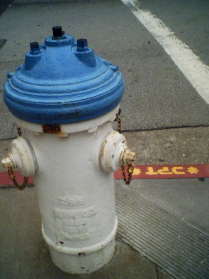 a close up of a blue and white fire hydrant