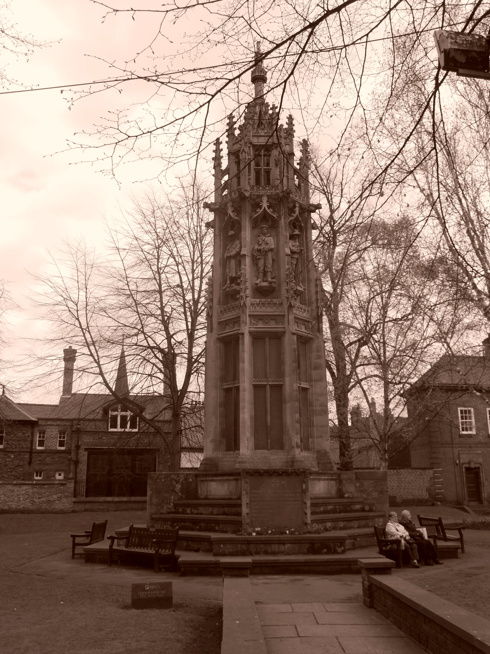 a building with a clock tower near other buildings