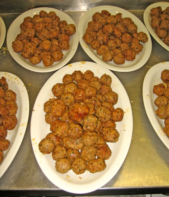 different sized plates holding food on a table