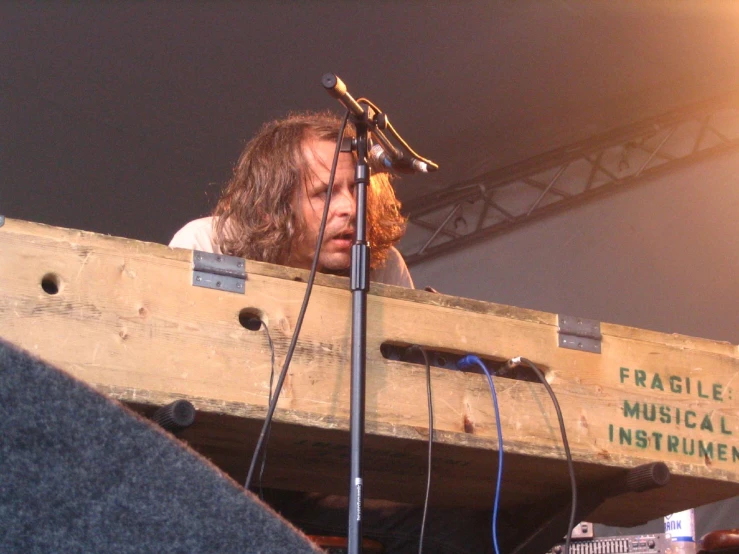 the woman is on the stage playing music