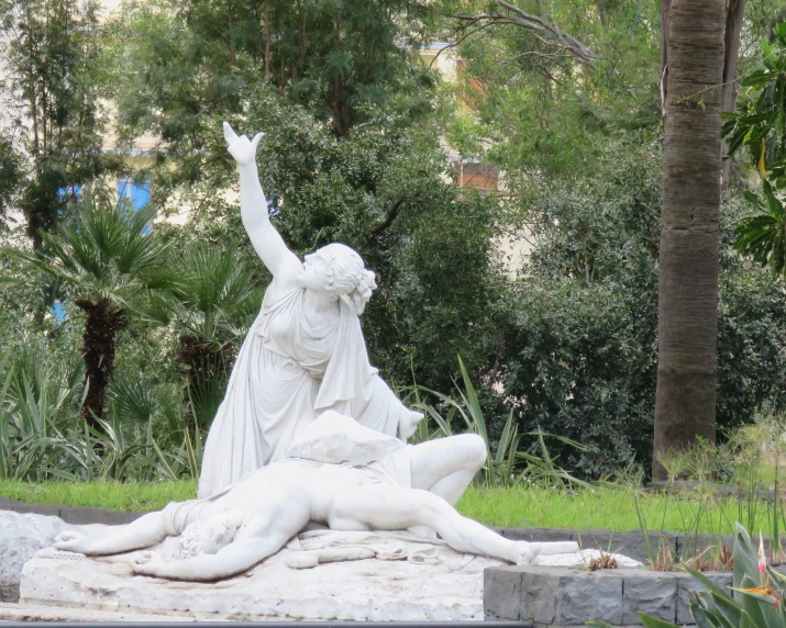 a stone statue is shown with two women in it