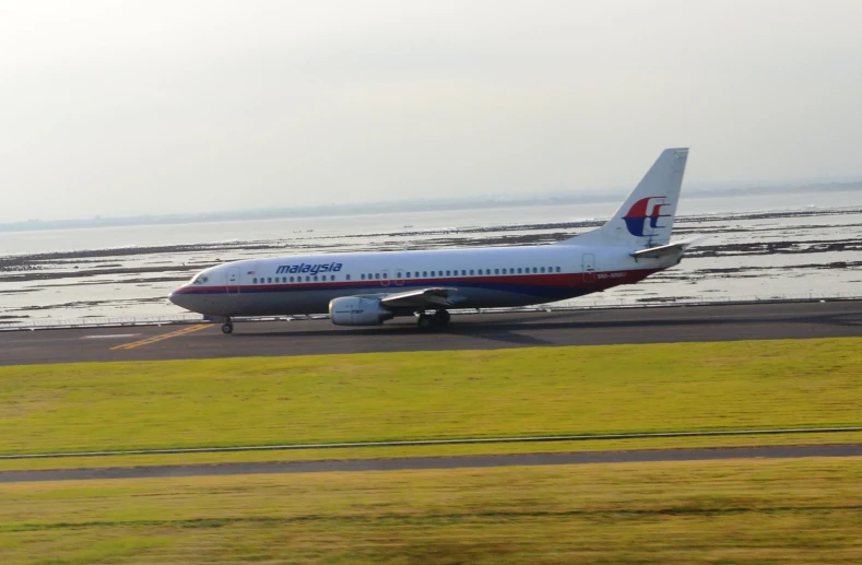 a passenger plane taxiing down the runway