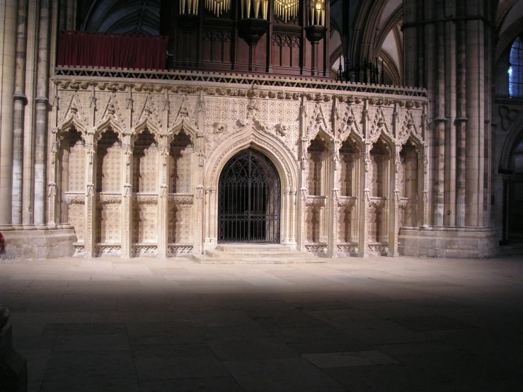 a church with an ornate wall and doors