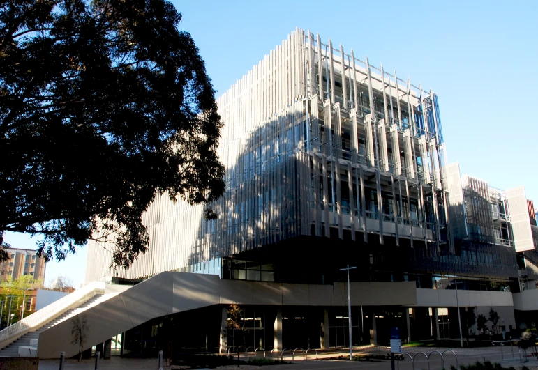 large building with sloping facade near street corner