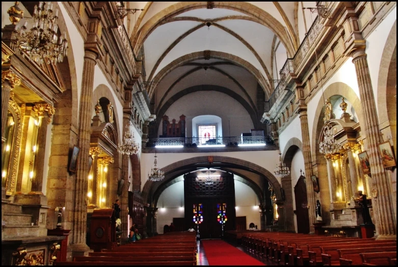 a cathedral with high vaulted ceilings and lights