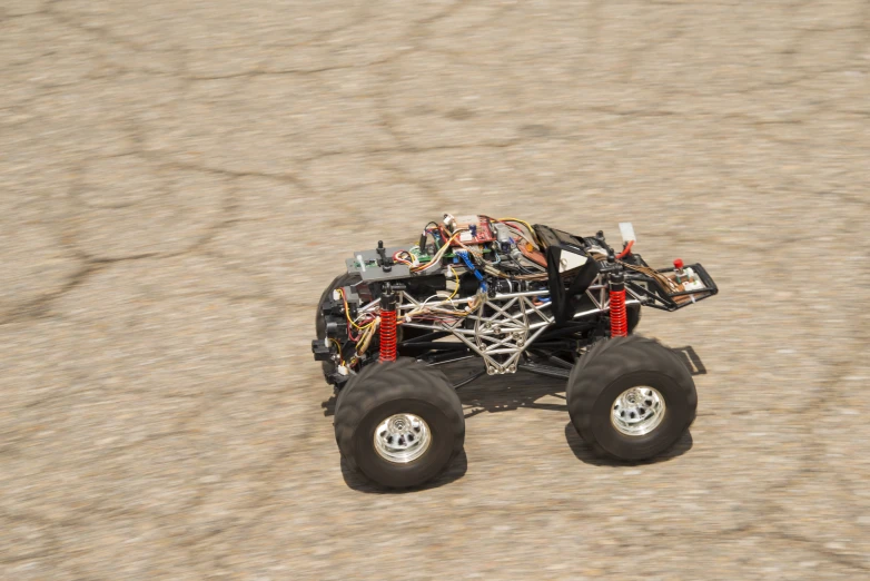 the small four wheeler is covered with wire and wires