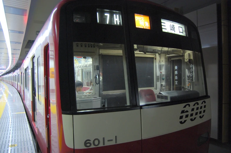 a modern train at a station waiting to leave