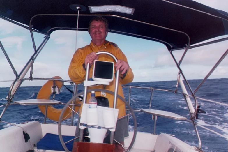 a man on a boat is smiling for the camera