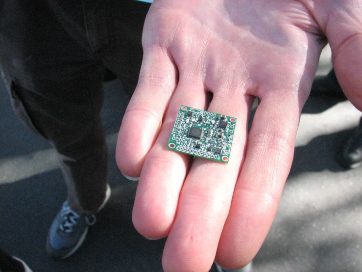 the man is holding a electronic board in his hand