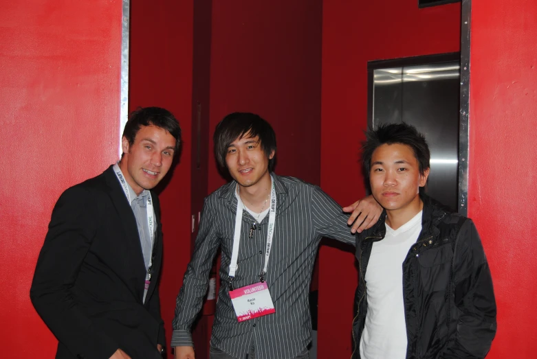 three young men are posing for a po