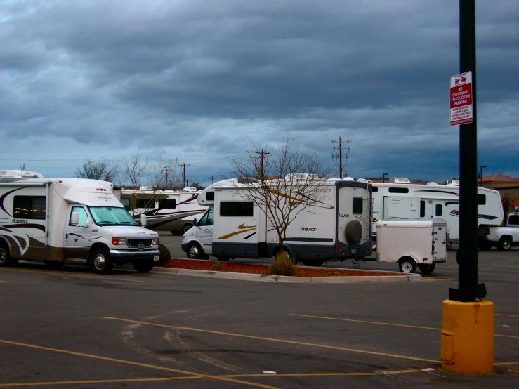 an rv park is shown with cars and trucks
