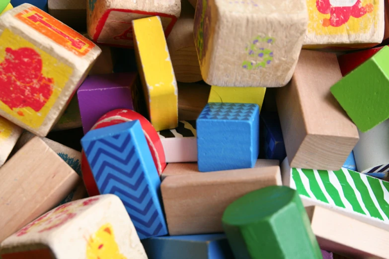 a large collection of wooden toys including building blocks