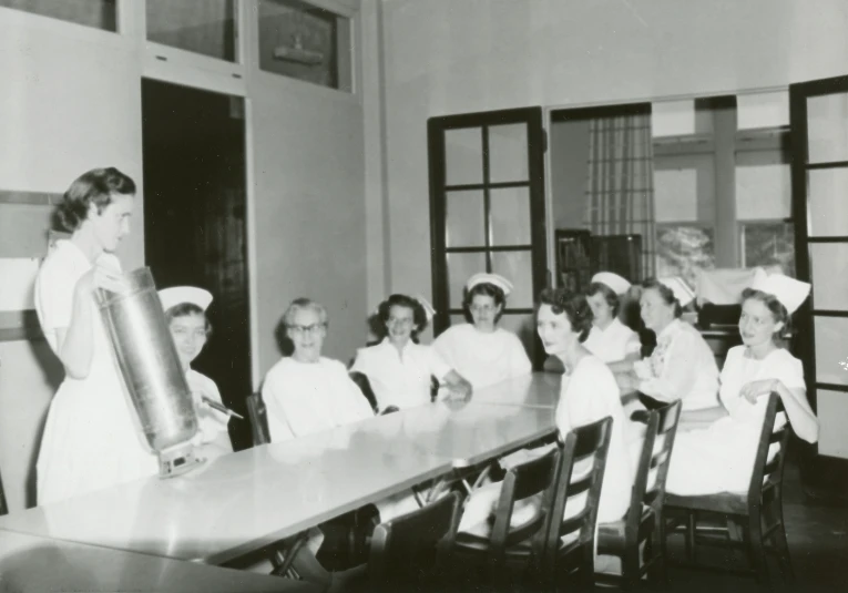 black and white pograph of nurses in a room