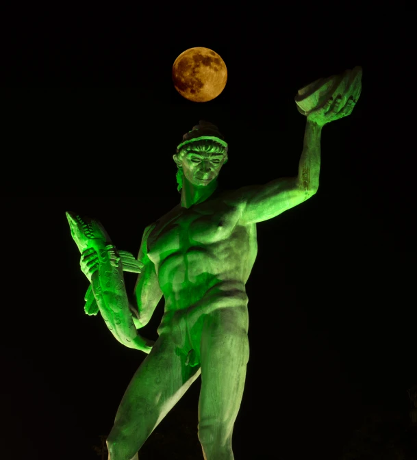 a green man juggling a soccer ball