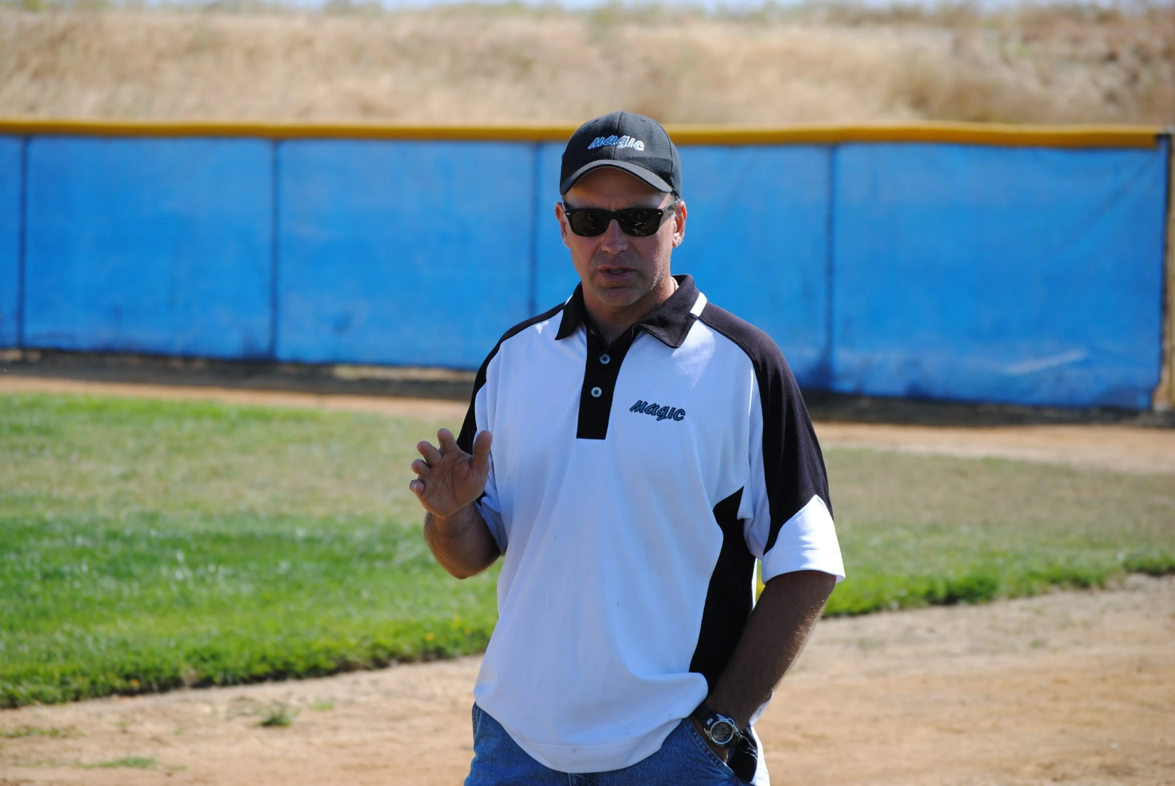 a man in white and black playing baseball