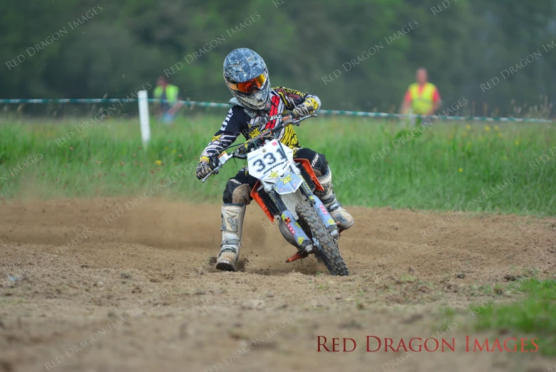 two dirt bikers racing each other on their bikes