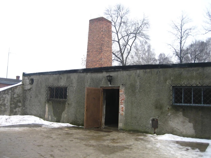 a large brick building on a snowy day