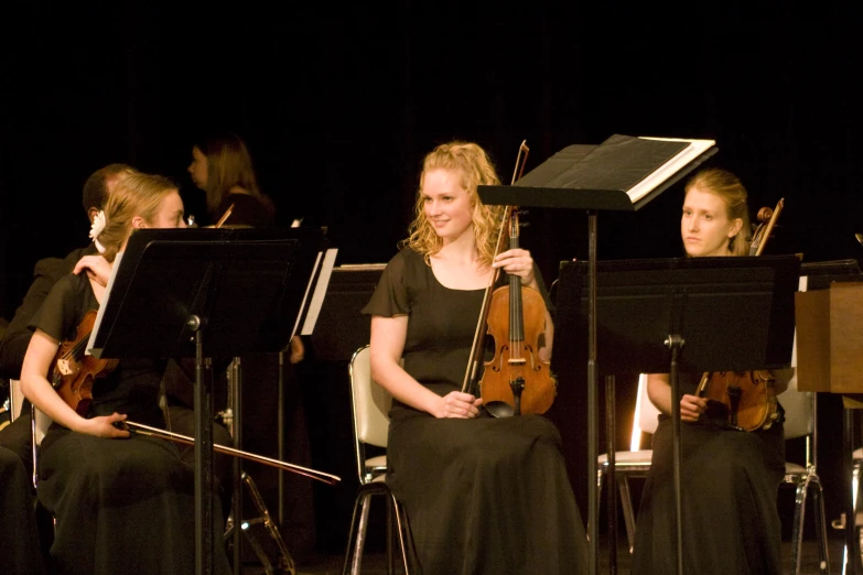 a musical group with musicians playing music