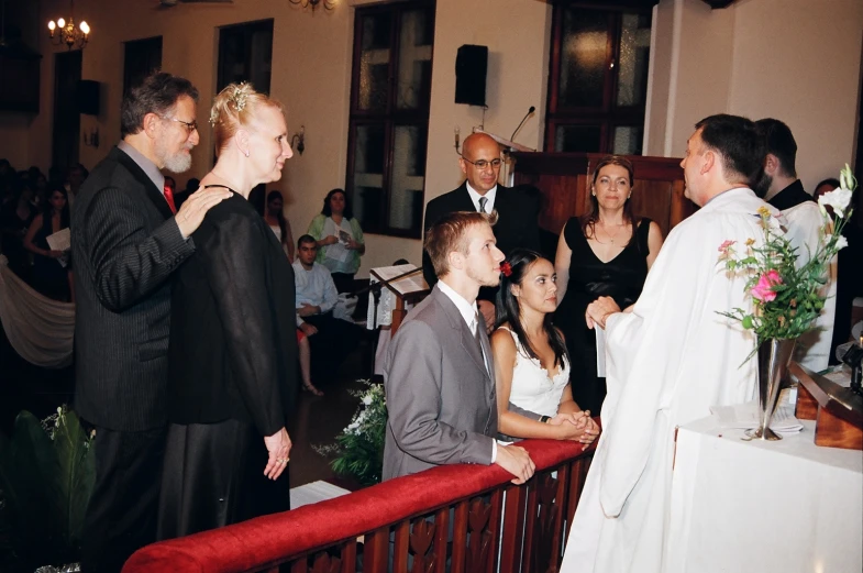 some men and women and one is in a wedding dress