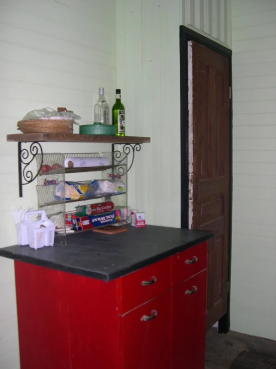 an empty pantry area with two shelves of food