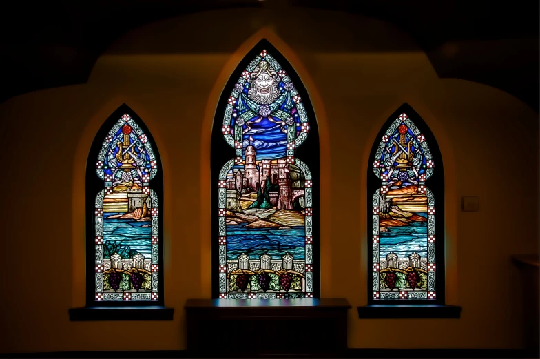 a cathedral has three stained glass windows