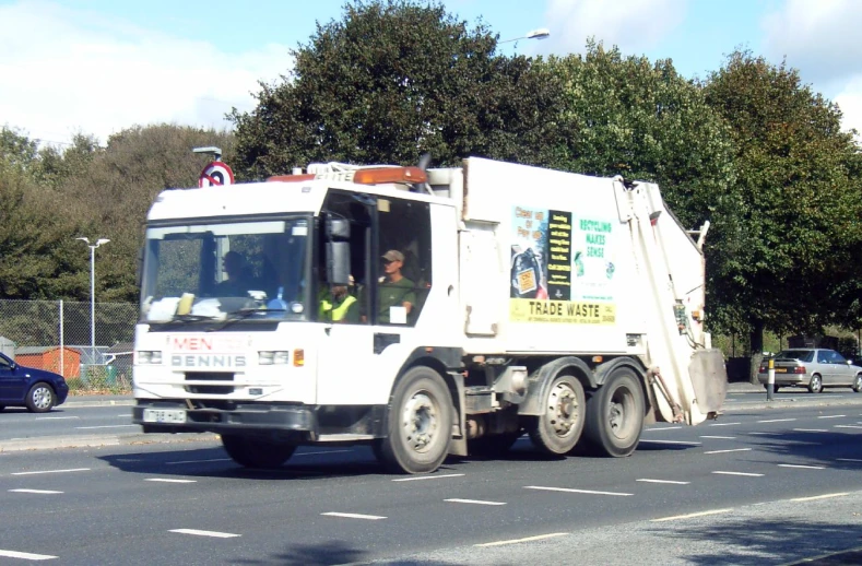 a dump truck driving down the street