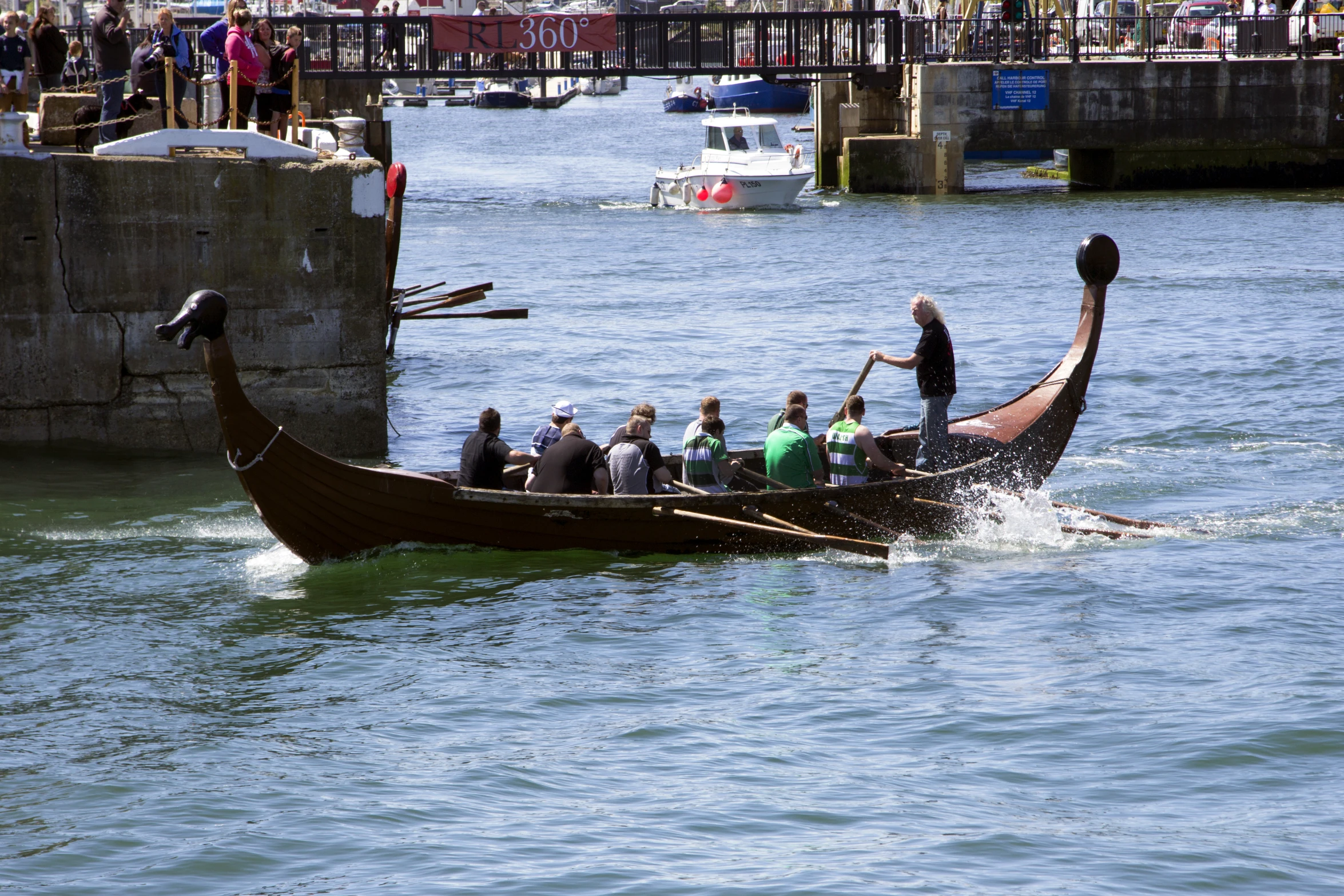 people ride in an old boat with an arrow on its head