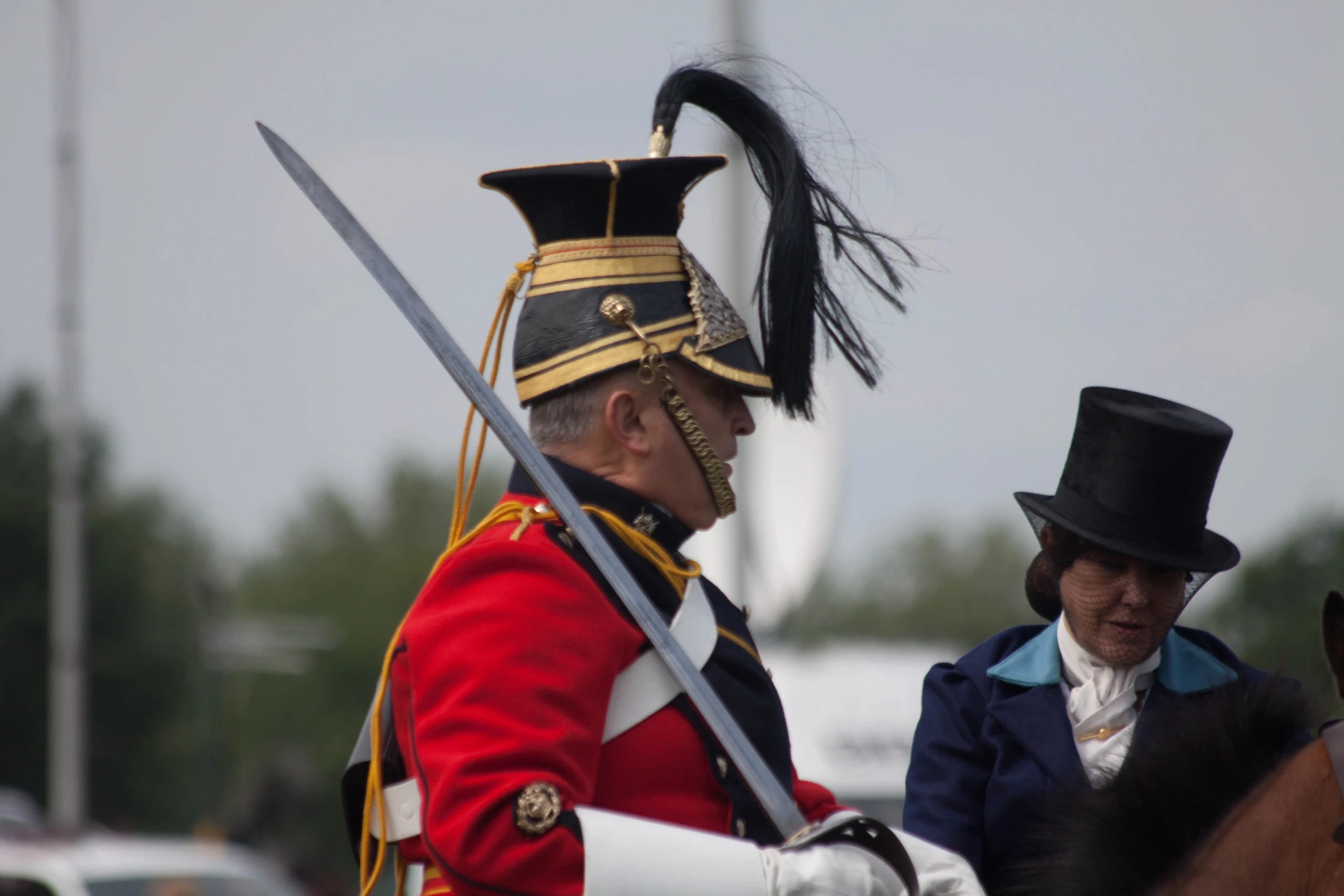 two soldiers are dressed up and riding on horses