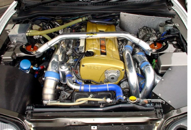 a yellow and black engine is on the hood