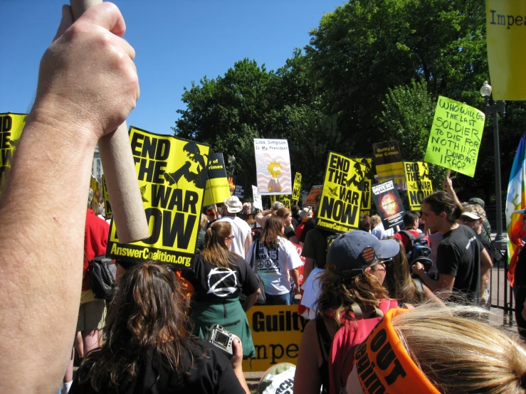 many people gathered at an outdoor protest rally