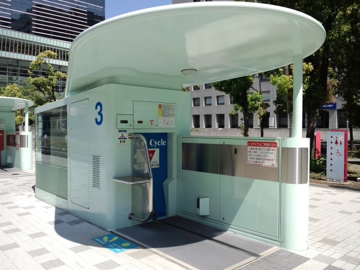 an old pay phone booth that has been painted in aqua blue