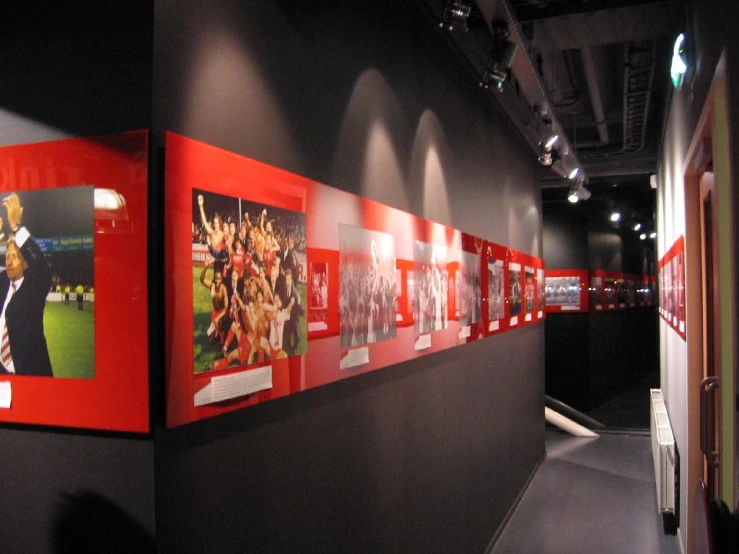 several pictures of sports players hanging on the walls