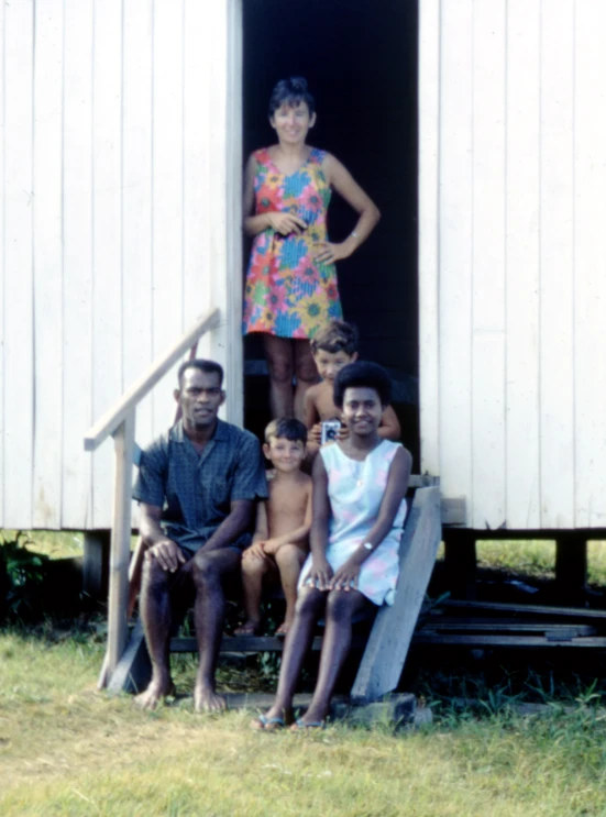 a small group of people that are standing on a staircase